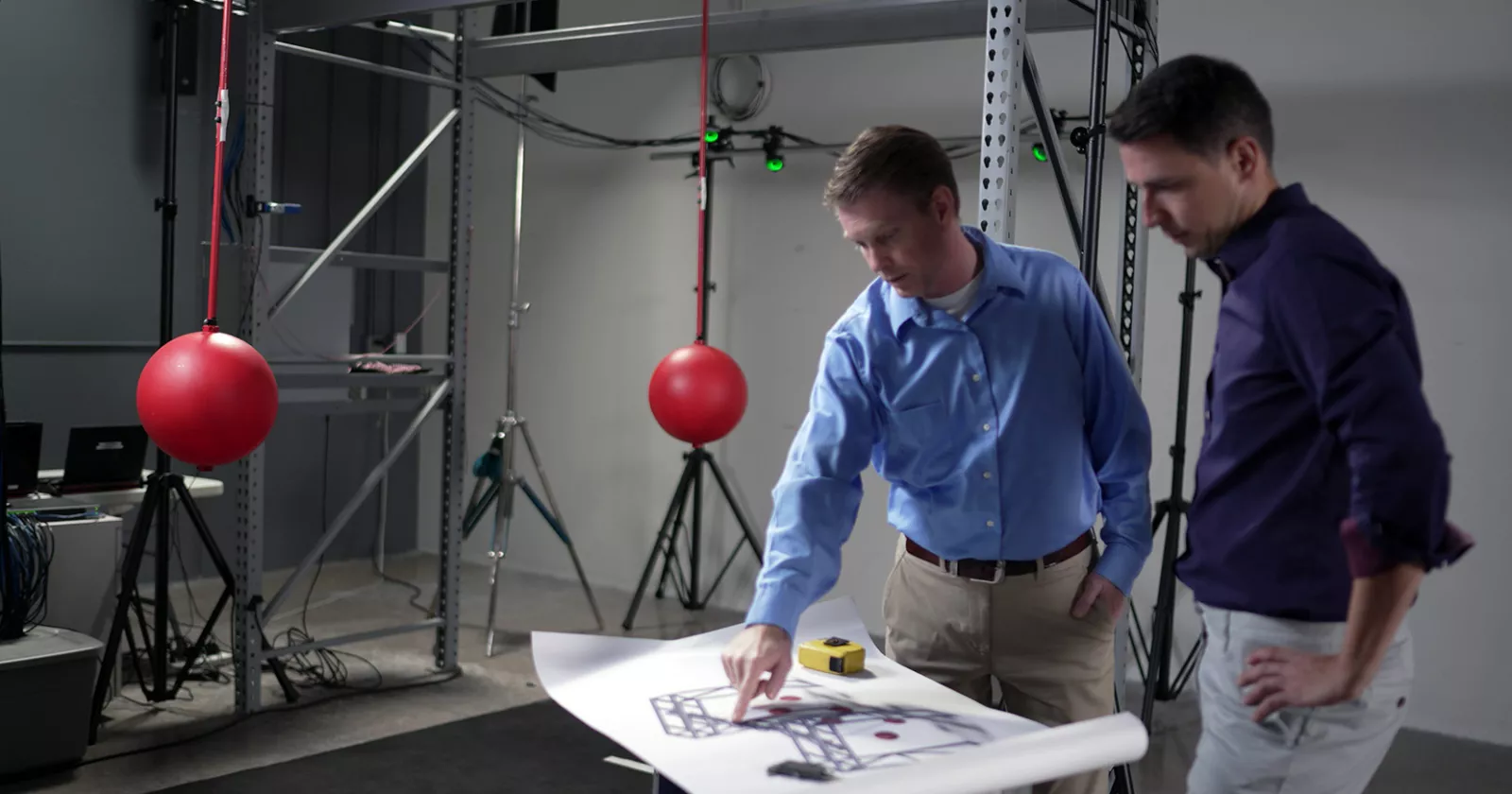 two men looking at plans