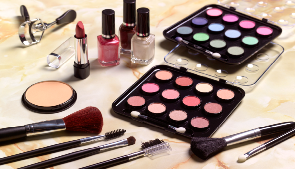 Blush/makeup brushes, lipstick, nail polish, and multi-colored eye shadow 