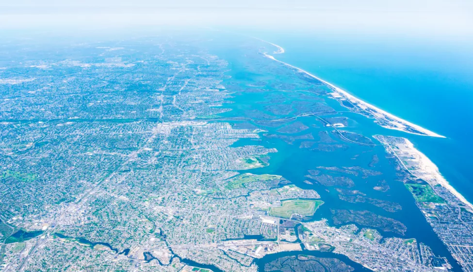 Aerial view of landscape with roads, waterways, and vegetation