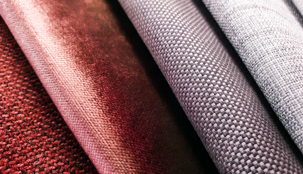 Close up of different textured and colored upholstery fabric samples