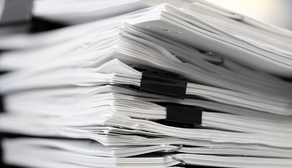 A stack of legal papers on a desk. Exponent provides technical expertise for all types of legal claims and disputes. 