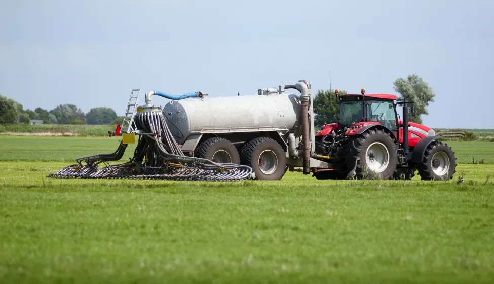 tractor with tank that can directly inject liquid manure into the ground for optimum nutrient placement and odor control