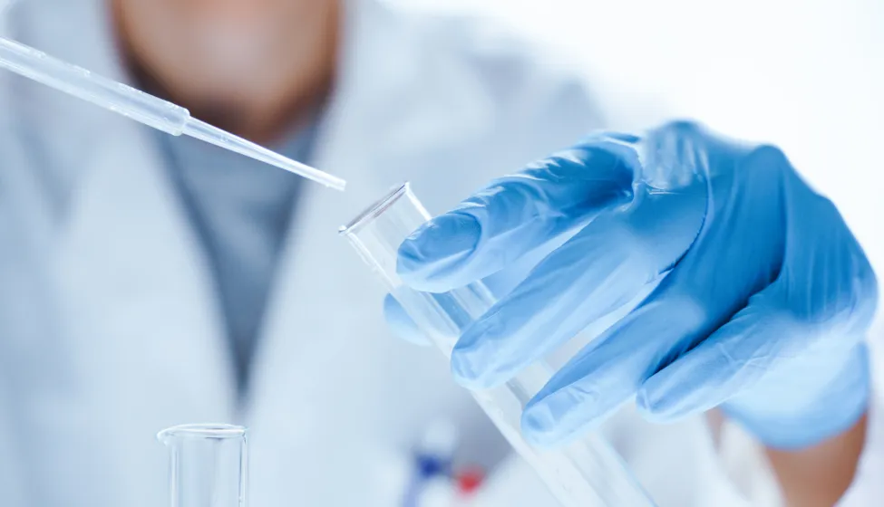 Microbiological research with a test tube and micropipette in close -up