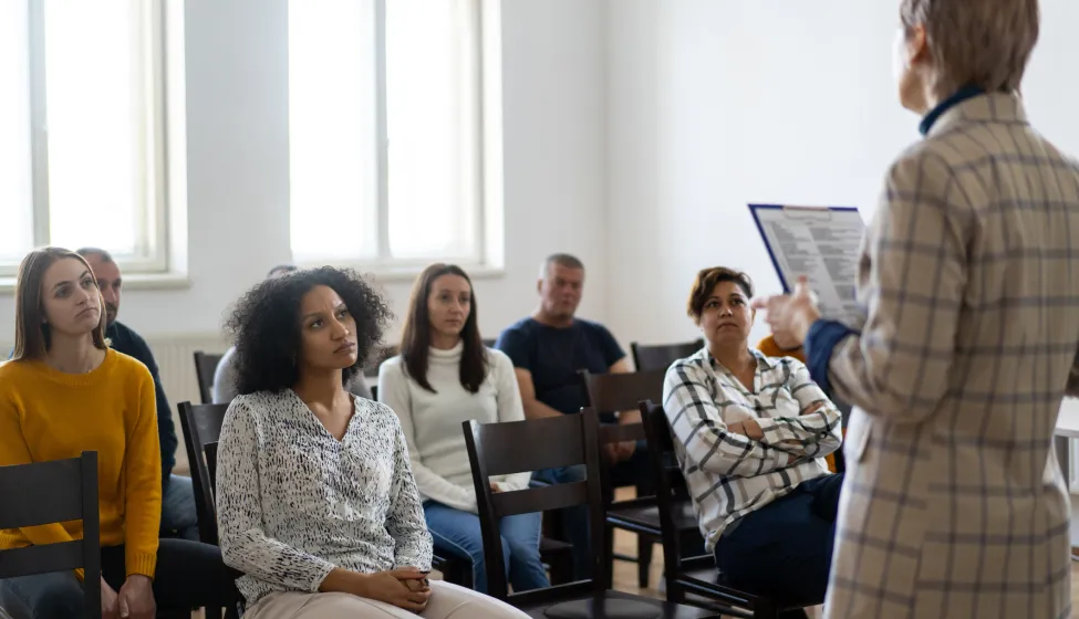 woman standing in front of a audience