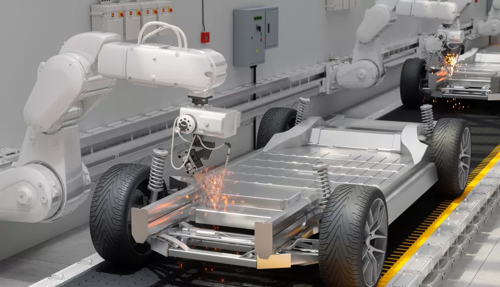 Close-up View Of Robot Arms Assembling Cars In Car Factory