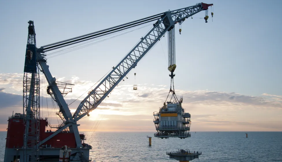 crane vessel installing a transformer platform in a windfarm
