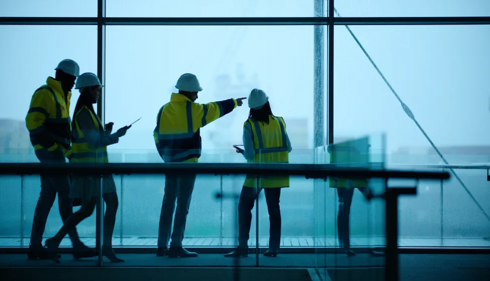 Construction, engineering and teamwork with building project, people and cooperation with brainstorming. Group, architects and industrial with support and modern office with safety and collaboration 