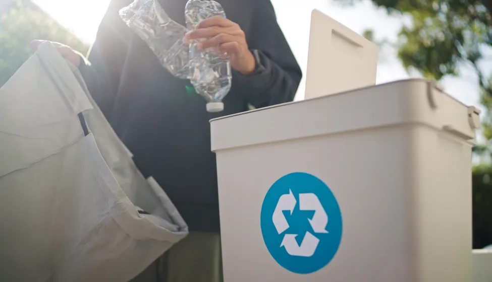 Man separating waste plastic bottle.