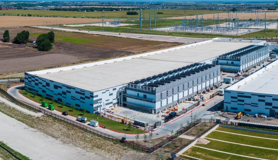Aerial view of a large data center campus with focus on the processor hosting area and power and cooling infrastructure being built in Hutto TX