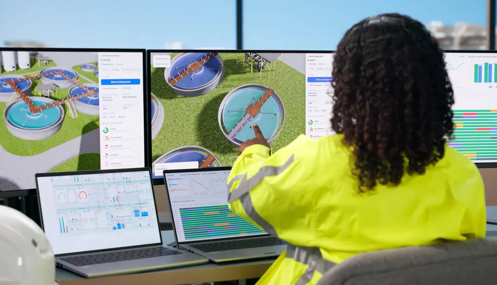 Woman Engineer Uses Computer To Monitor Water Treatment System Quality.