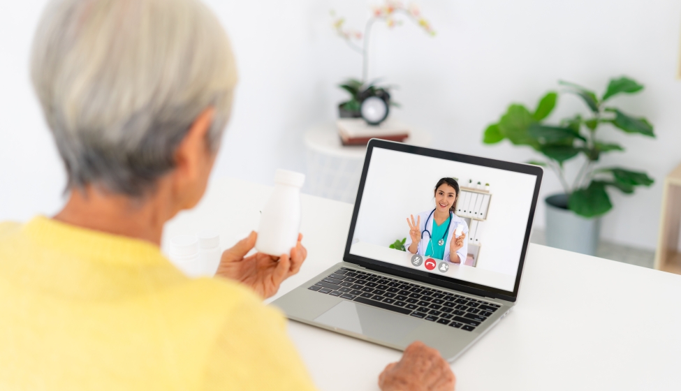 A patient on a telemedicine meeting with their doctor