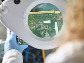 An Engineer evaluating electronic components. Exponent electrical engineers and computer scientists consult on  electronics.
