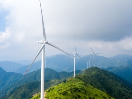 Wind turbines on a mountain range. Exponent's Environment & Sustainability expertise helps you make informed decisions.