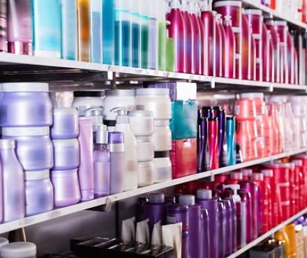shelves with conditioners and mousses for hair in the store