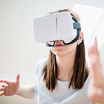 Person wearing a virtual reality headset. Exponent  helps innovators explore the possibilities of virtual reality products.